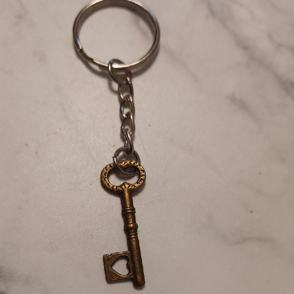 4/$60 New Bronze Key Shaped Keychain